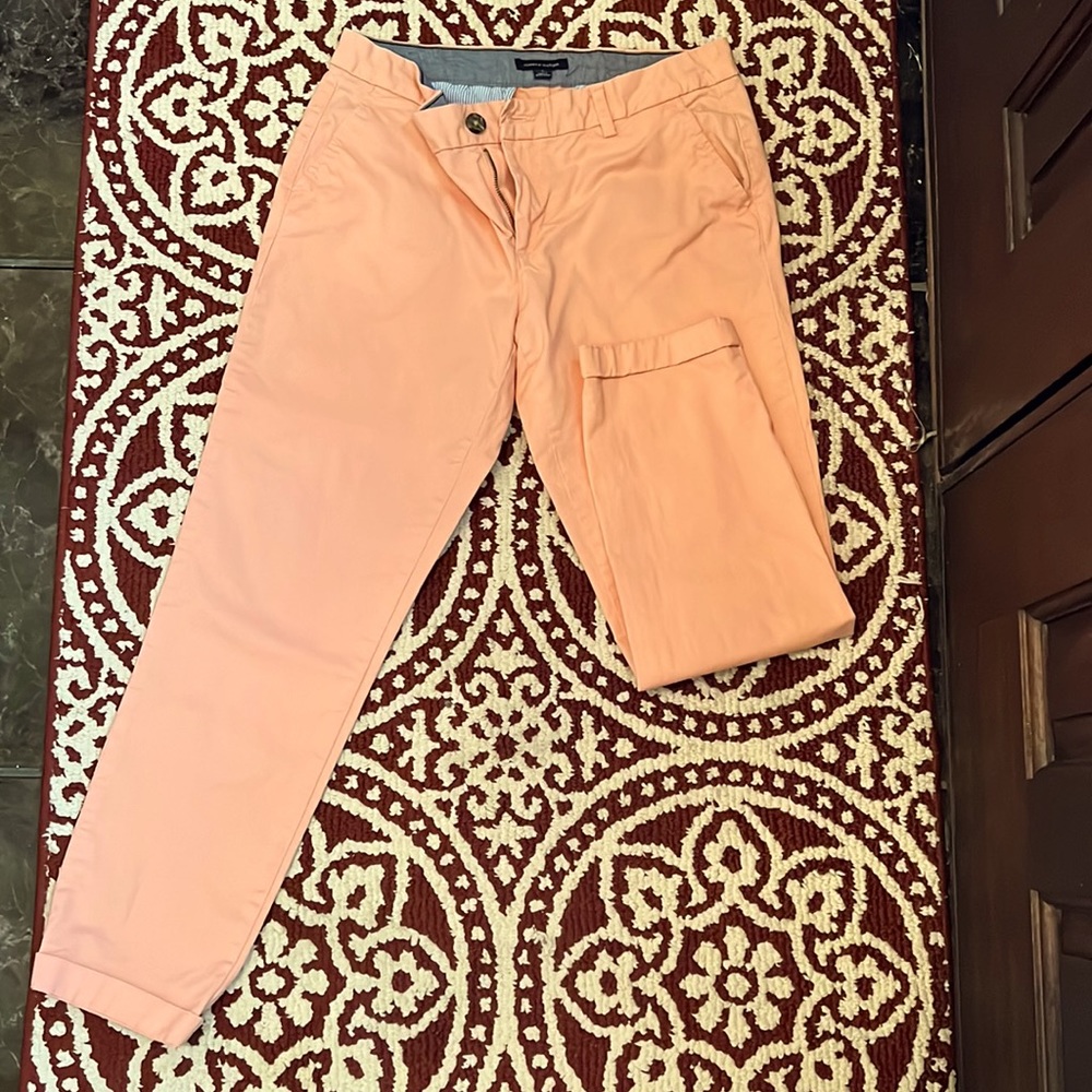 Peach colored khaki pants with cuffed ankle